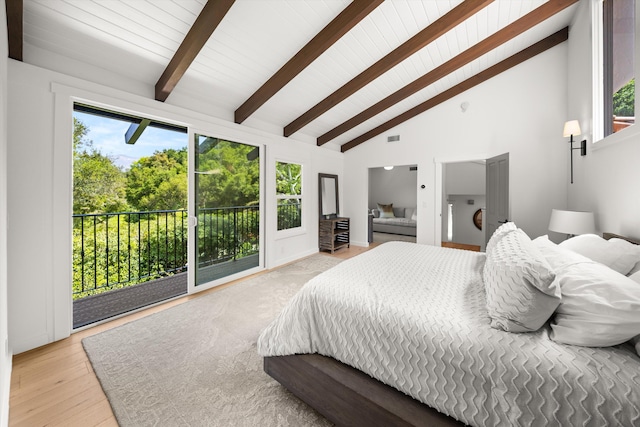 bedroom featuring multiple windows, beam ceiling, high vaulted ceiling, and access to exterior