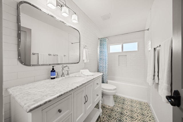 full bath with tile patterned floors, vaulted ceiling, toilet, vanity, and shower / tub combo