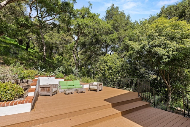 wooden terrace featuring an outdoor hangout area