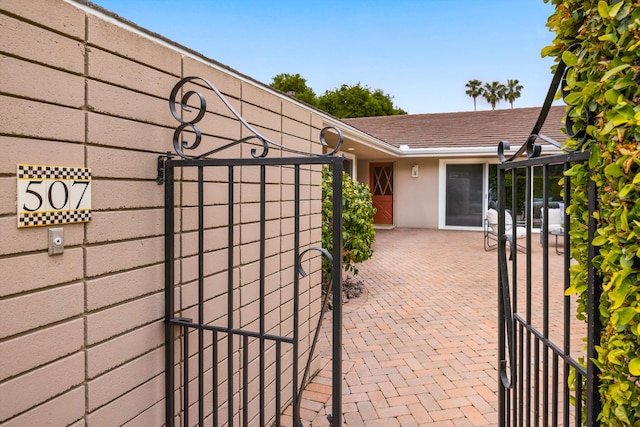 view of patio / terrace featuring a gate and fence