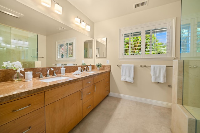full bathroom with visible vents, a sink, and a healthy amount of sunlight