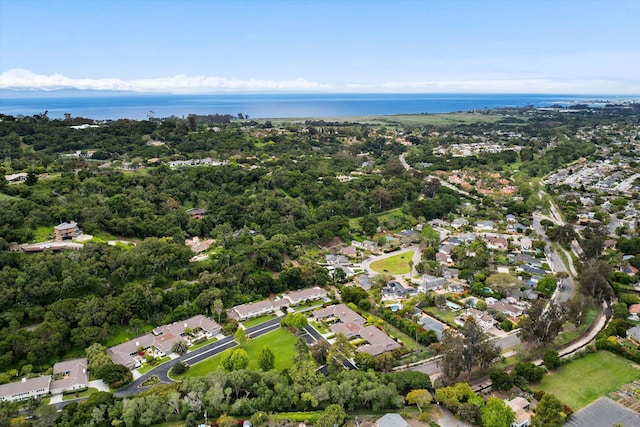 drone / aerial view featuring a water view and a residential view