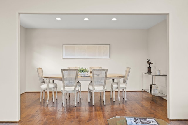 dining room with hardwood / wood-style floors and recessed lighting