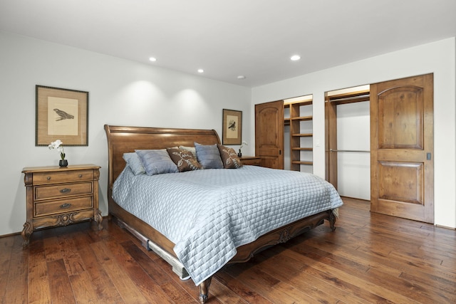 bedroom with dark wood-style flooring and recessed lighting