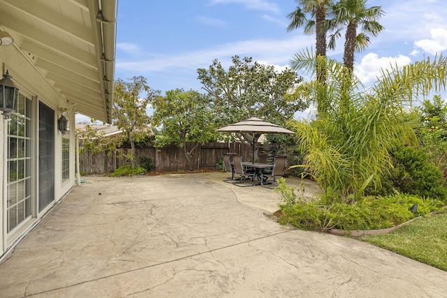 view of patio / terrace featuring outdoor dining area and fence