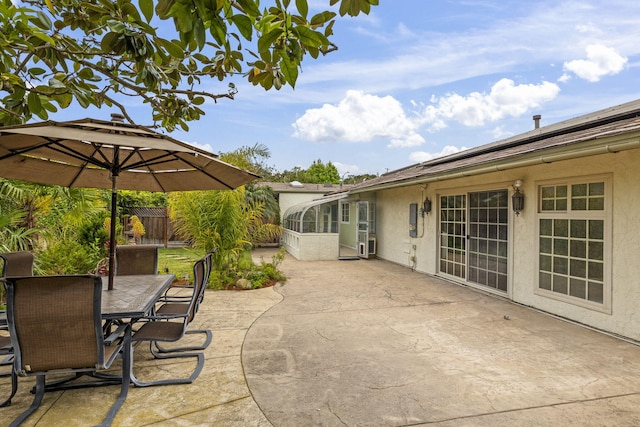 view of patio featuring fence and outdoor dining area