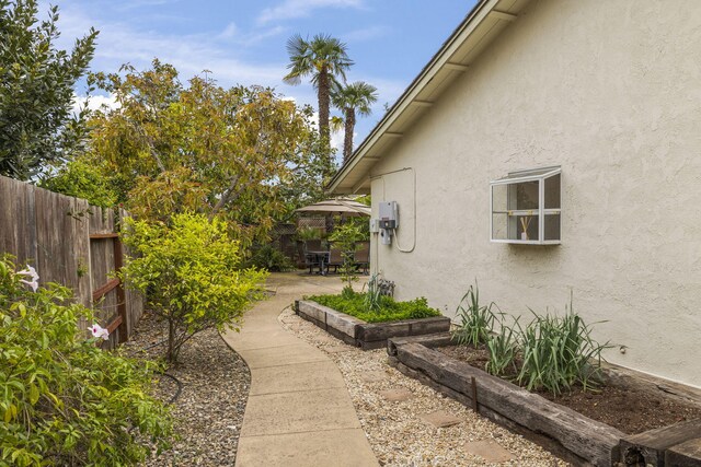 view of yard with fence and a patio area