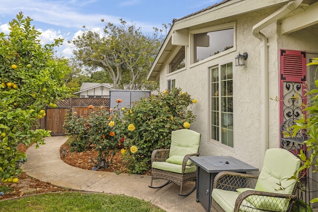 view of patio / terrace featuring fence
