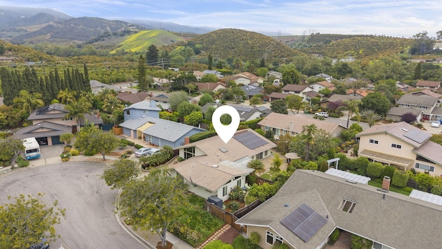 birds eye view of property featuring a mountain view and a residential view