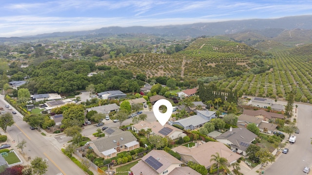 birds eye view of property with a mountain view