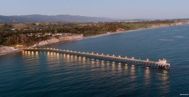 birds eye view of property featuring a water and mountain view