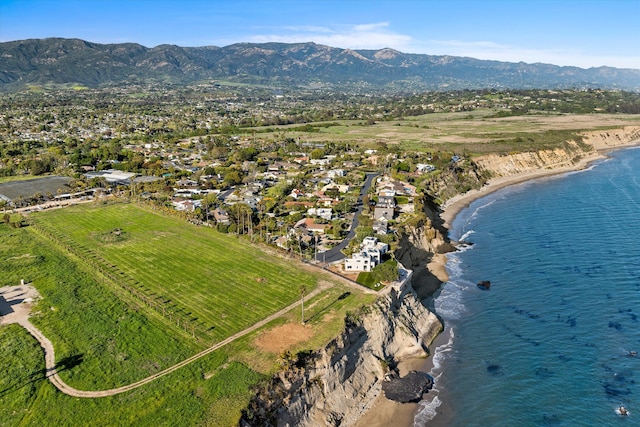 aerial view featuring a water and mountain view