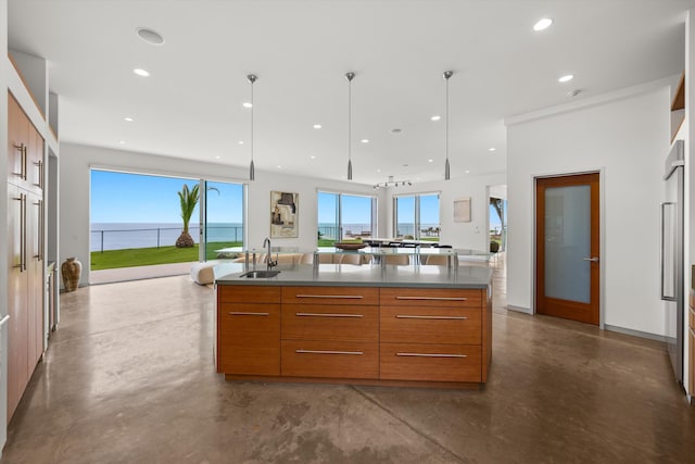 kitchen featuring concrete flooring, brown cabinetry, a sink, and modern cabinets