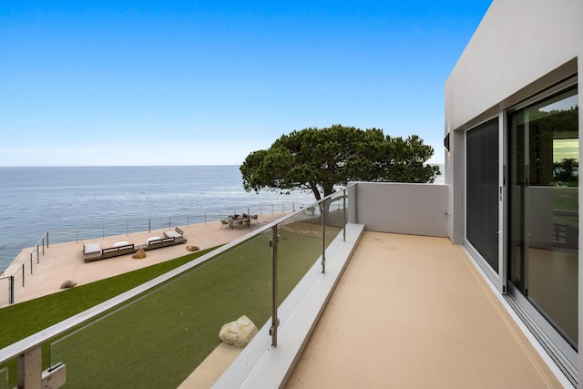 balcony featuring a water view