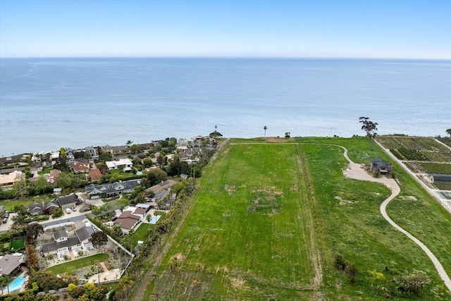 drone / aerial view with a residential view and a water view