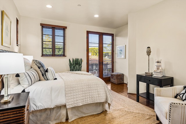 bedroom featuring multiple windows, wood finished floors, and recessed lighting