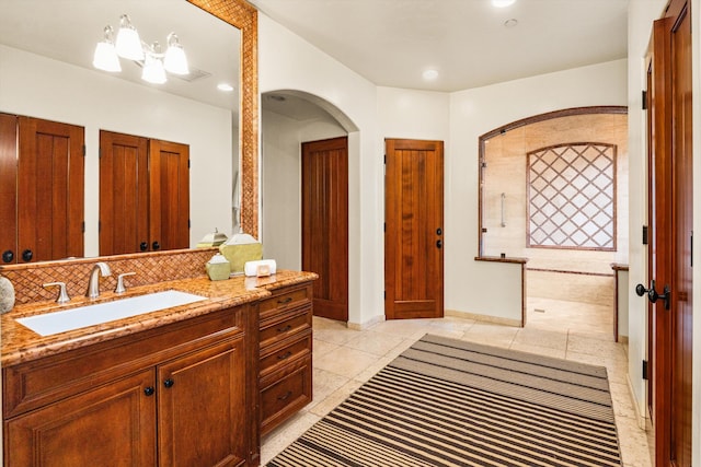 full bathroom with recessed lighting, tile patterned flooring, backsplash, vanity, and walk in shower