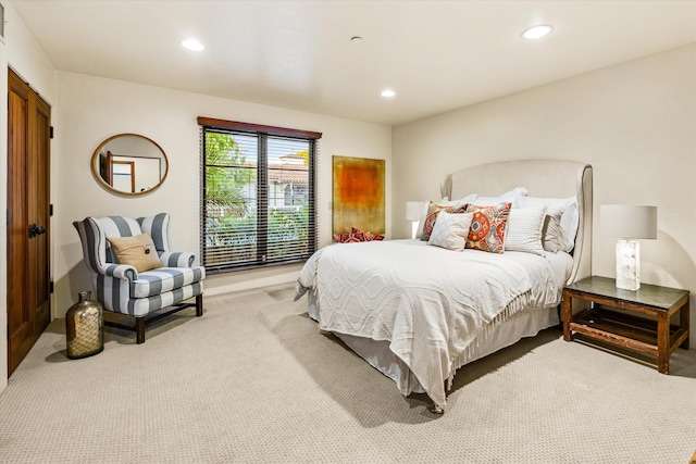 carpeted bedroom with recessed lighting