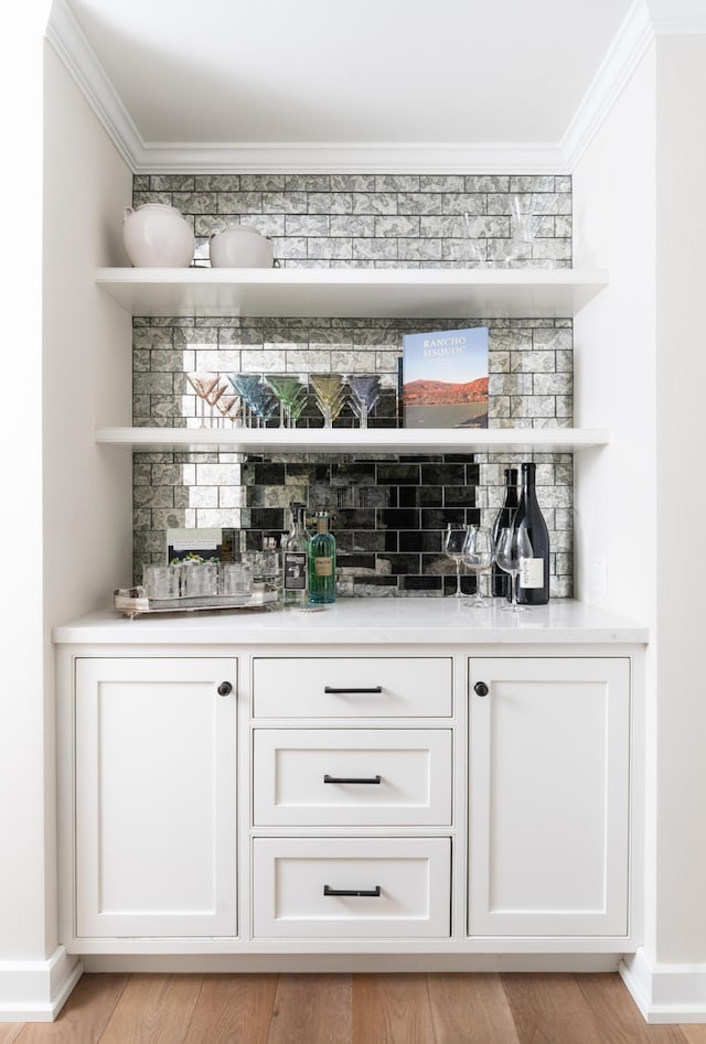 2749 Sycamore Canyon Rd, Santa Barbara, CA 93108 - bar featuring crown molding, baseboards, and a bar