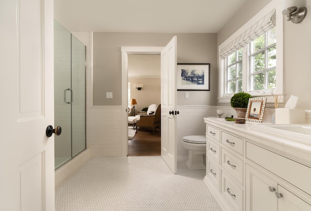 2749 Sycamore Canyon Rd, Santa Barbara, CA 93108 - full bath featuring tile walls, a stall shower, vanity, a wainscoted wall, and toilet