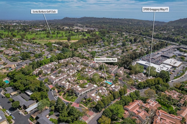 birds eye view of property with a mountain view and a residential view