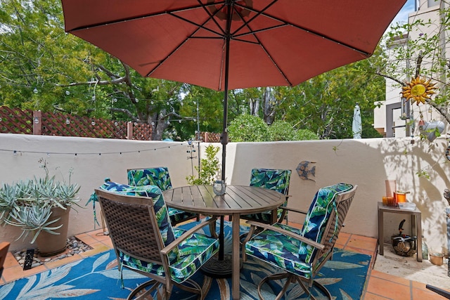 view of patio / terrace with outdoor dining area and a fenced backyard