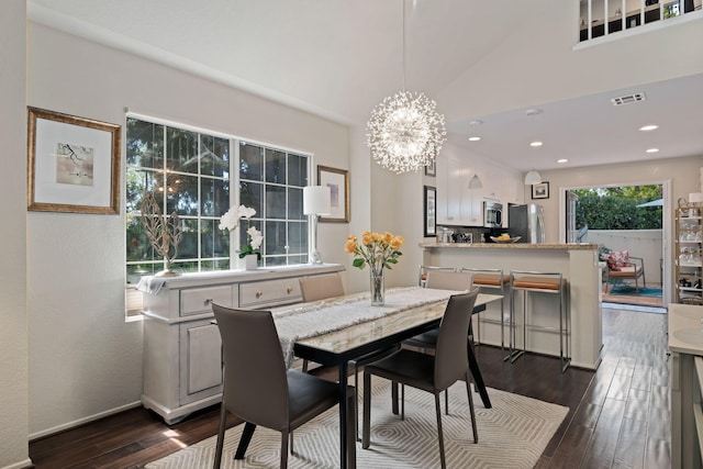 dining room featuring vaulted ceiling, an inviting chandelier, baseboards, dark wood-style flooring, and recessed lighting