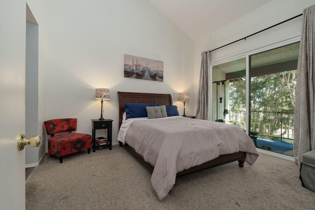 bedroom featuring lofted ceiling, carpet flooring, access to exterior, and baseboards