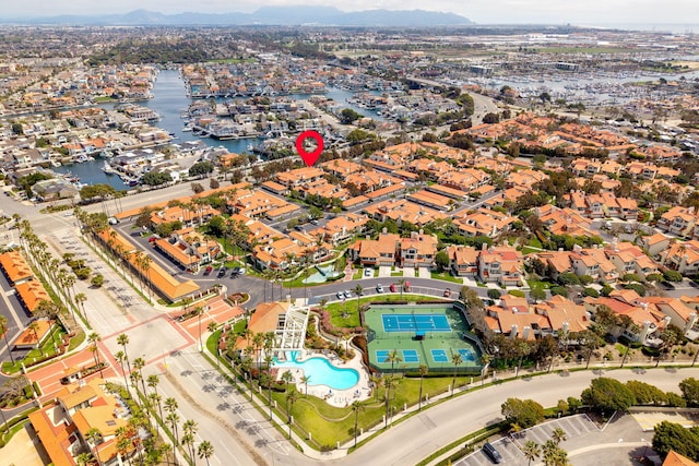 drone / aerial view with a water view and a residential view