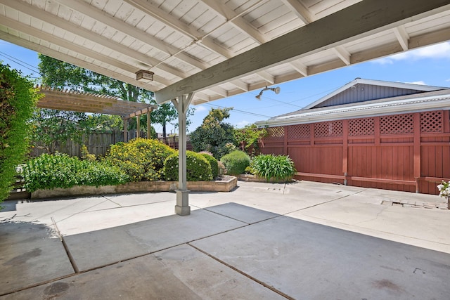 view of patio / terrace featuring a pergola and fence