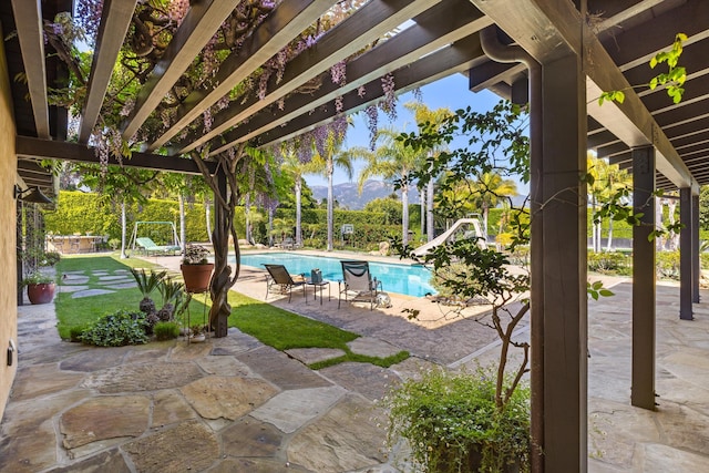 view of patio with a pergola and an outdoor pool