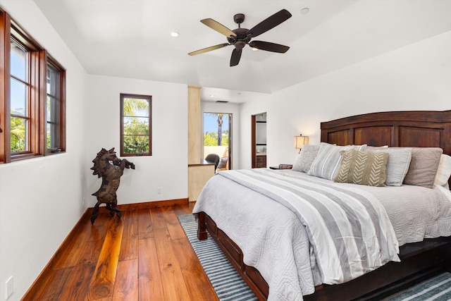 bedroom with ceiling fan, access to exterior, baseboards, wood-type flooring, and recessed lighting
