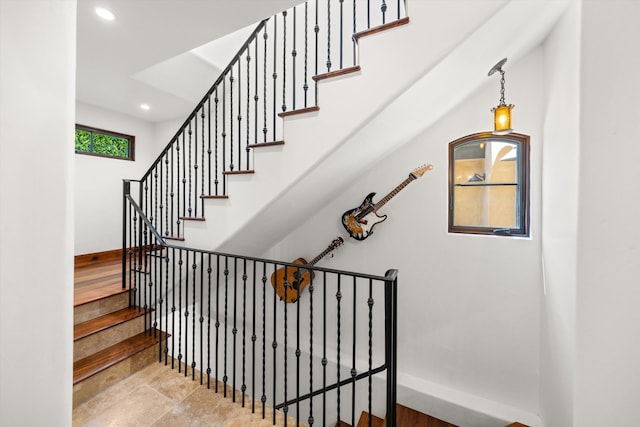 staircase featuring recessed lighting