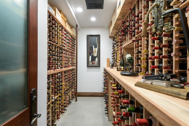 wine cellar with baseboards and recessed lighting