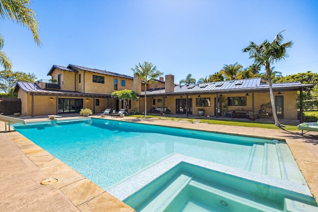 outdoor pool featuring a patio, a diving board, and a water slide