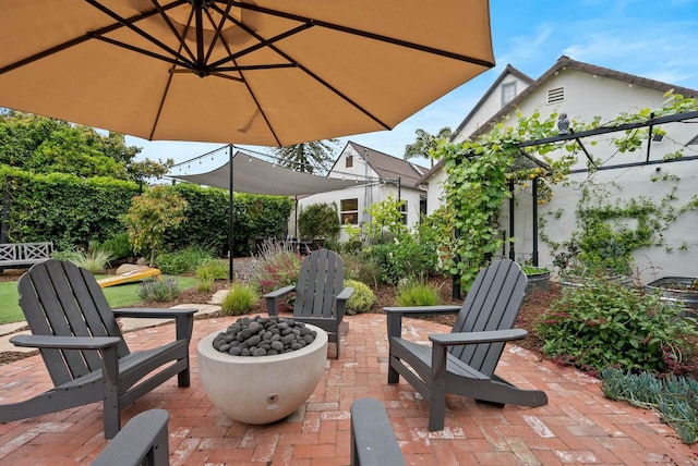 view of patio featuring an outdoor fire pit