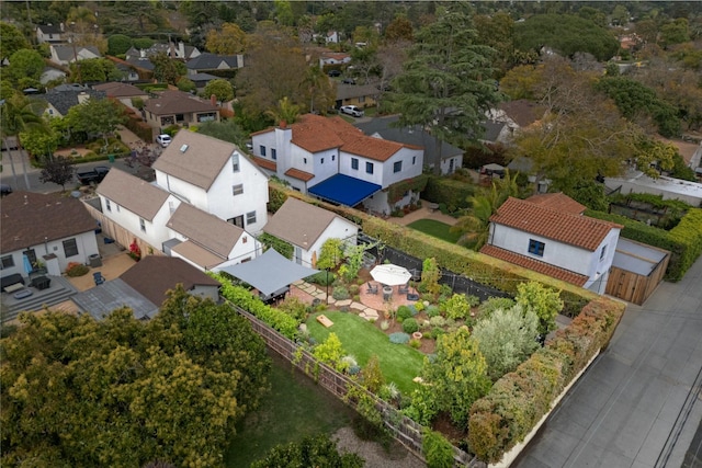 birds eye view of property with a residential view