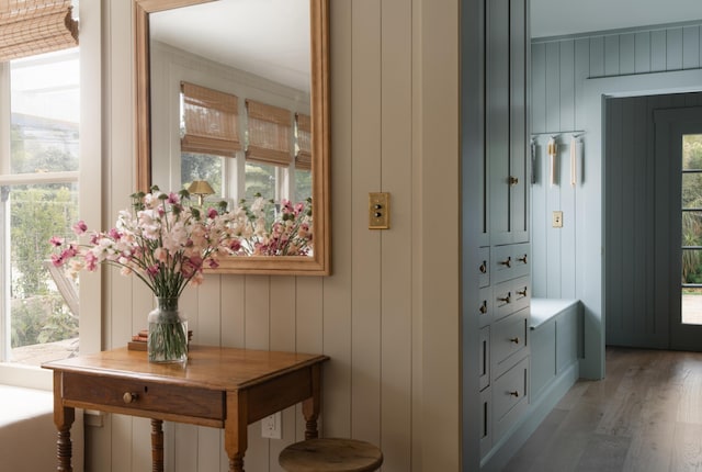 interior space with a decorative wall and wood finished floors