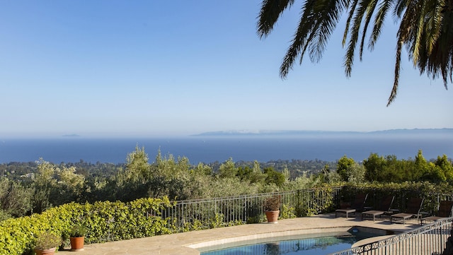 view of pool with a patio, a fenced in pool, and fence