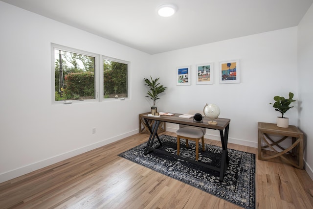 office featuring wood finished floors and baseboards