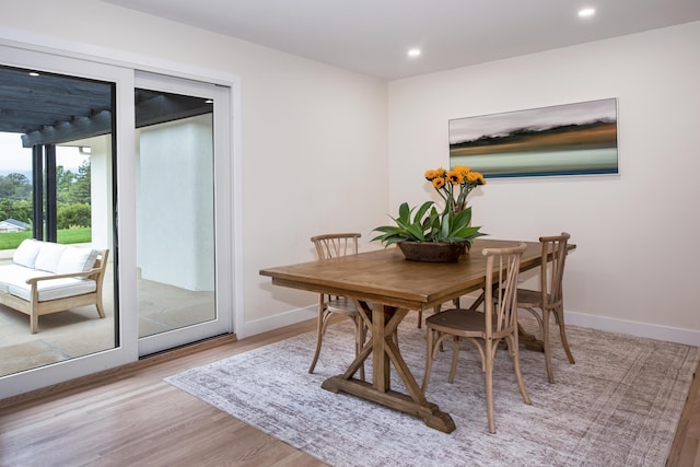 dining area with recessed lighting, wood finished floors, and baseboards