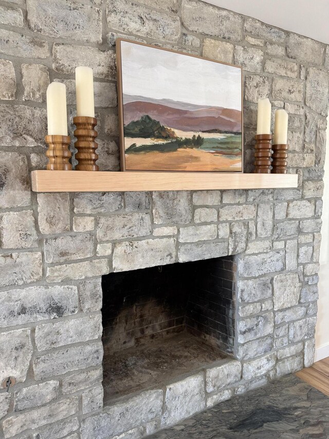 room details with wood finished floors and a fireplace