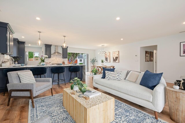 719 Camino Cascada, Santa Barbara, CA 93111 - living area with recessed lighting, light wood-style flooring, and an inviting chandelier