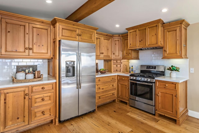 2760 Williams Way, Santa Barbara, CA 93105 - kitchen featuring light countertops, light wood finished floors, appliances with stainless steel finishes, and backsplash