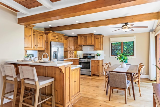 2760 Williams Way, Santa Barbara, CA 93105 - kitchen featuring decorative backsplash, beamed ceiling, recessed lighting, light countertops, and appliances with stainless steel finishes