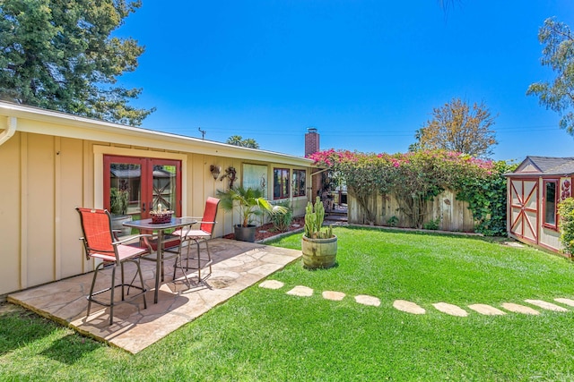 2760 Williams Way, Santa Barbara, CA 93105 - rear view of property with board and batten siding, a chimney, a storage unit, a yard, and a patio