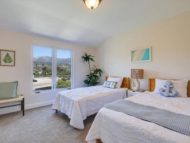 bedroom featuring carpet floors and baseboards