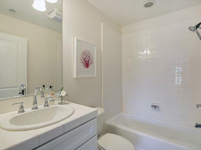 full bath featuring shower / bathtub combination, toilet, and vanity