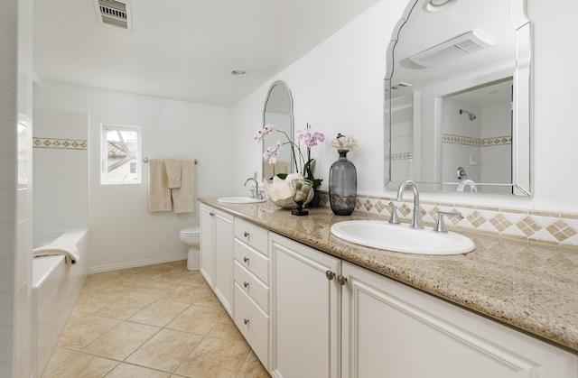 bathroom featuring visible vents, toilet, and a sink