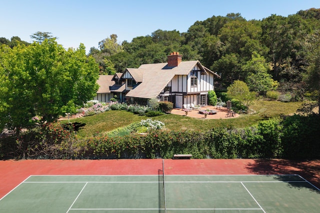 4385 Via Presada, Santa Barbara, CA 93110 - view of tennis court with a wooded view